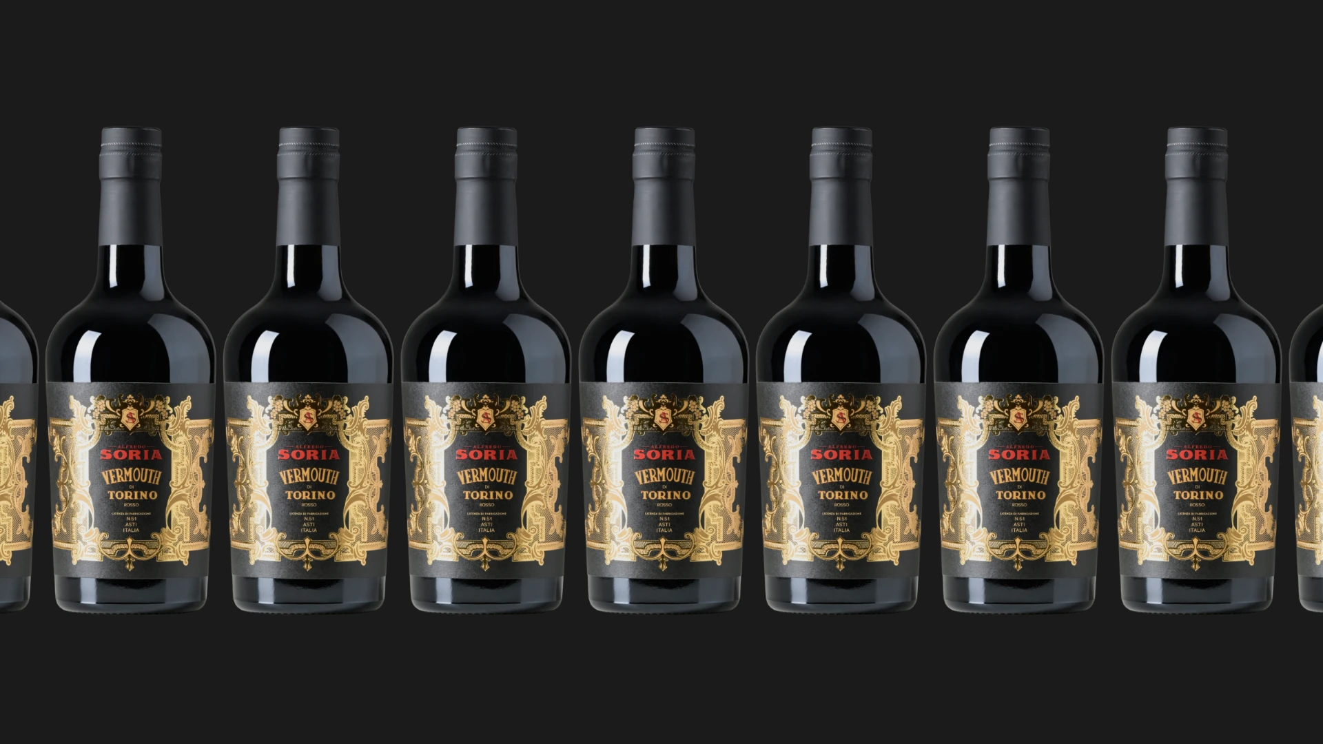 A row of Alfredo Soria Vermouth di Torino Rosso bottles on a dark ground